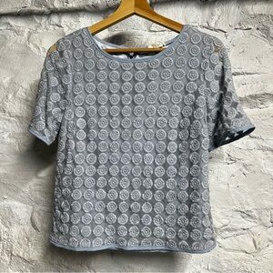 Baby blue layered polyester, cotton, mesh shirt with floral circle texture